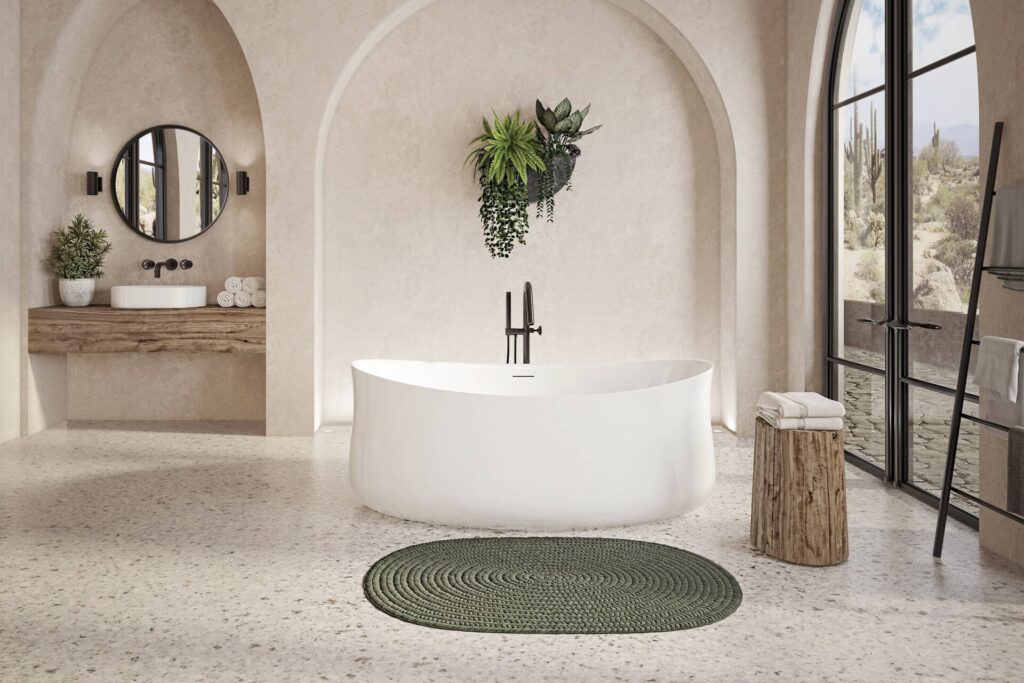 Bain autoportant de forme arrondie au fini blanc dans un joli décor de salle de bain